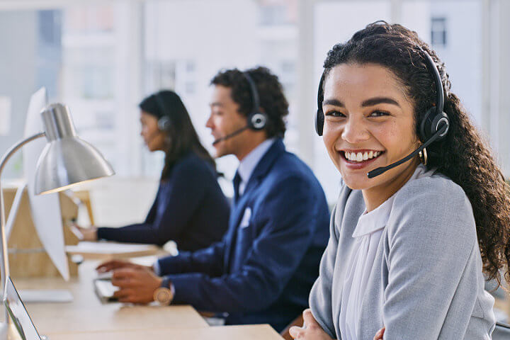 Smiling customer service operator in UCaaS